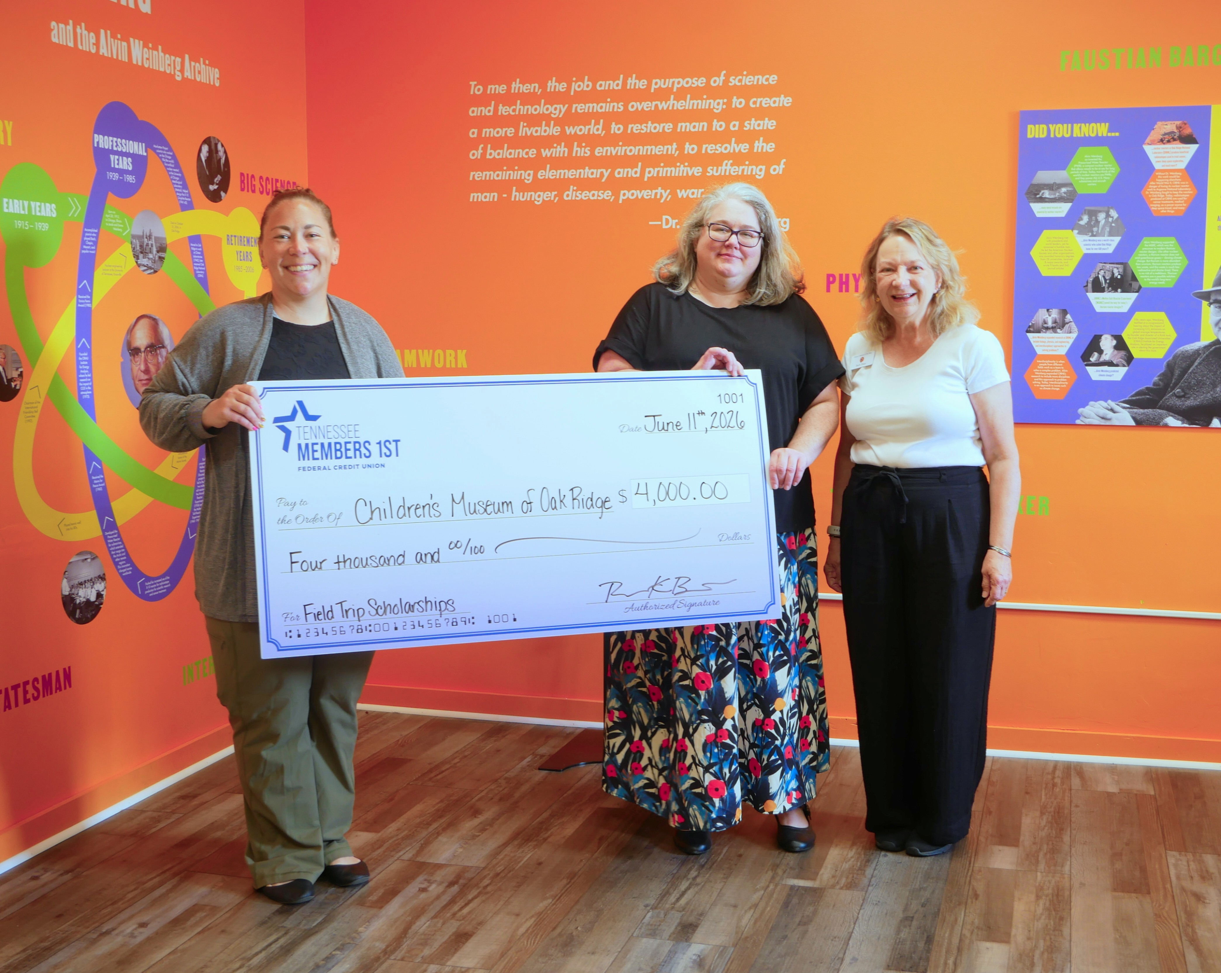 Richelle visits the Children's Museum of Oak Ridge and presents a check to support school field trips.