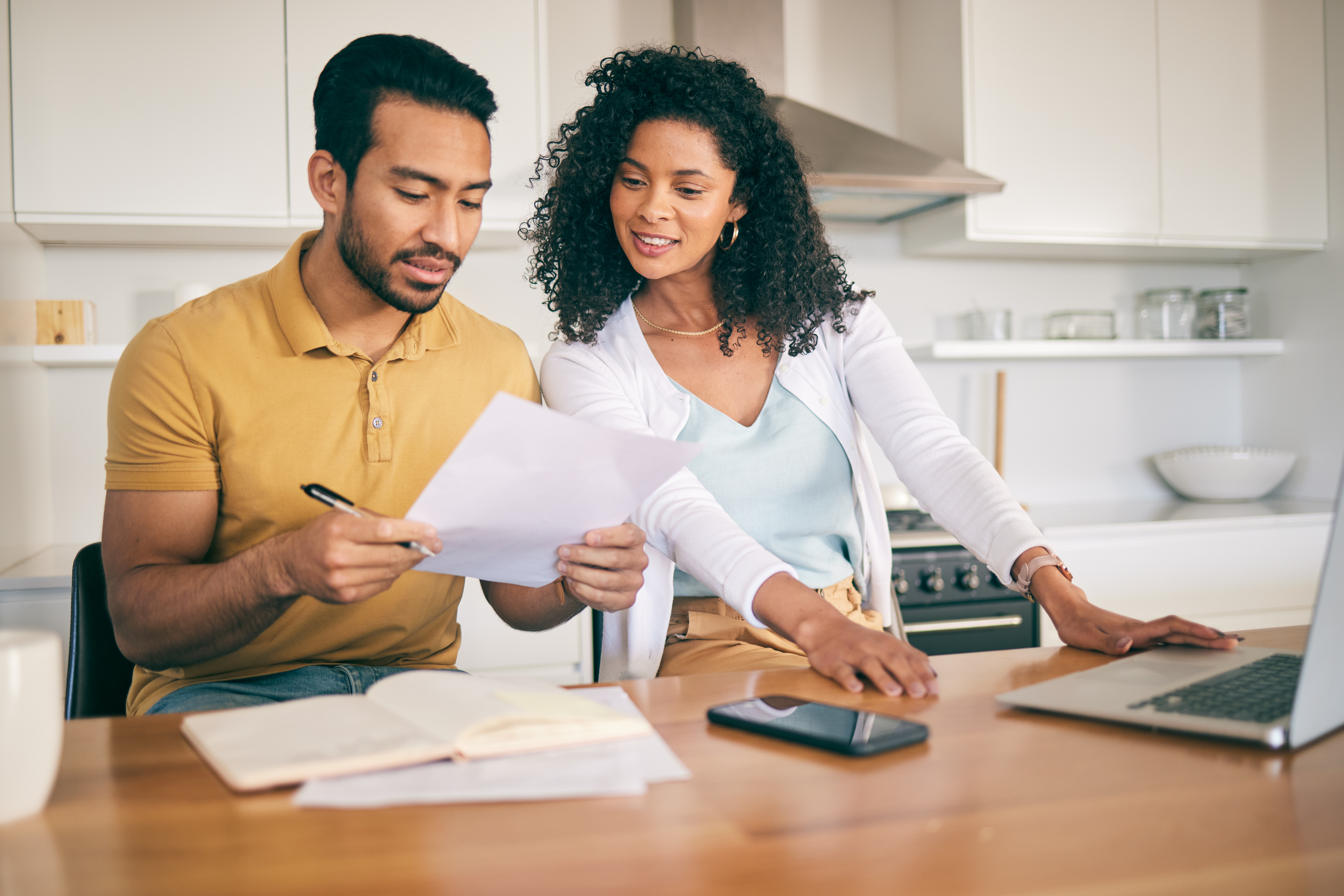 A middle age couple reviews their finances.